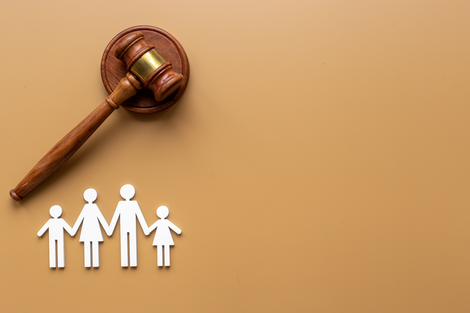 Family figure with judge gavel. Family law concept